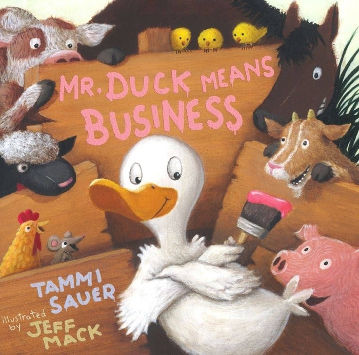 Duck with a paint brush in front of a sign with "Mr. Duck Means Business" painted on the sign. Other farm animals are gathered around the sign.