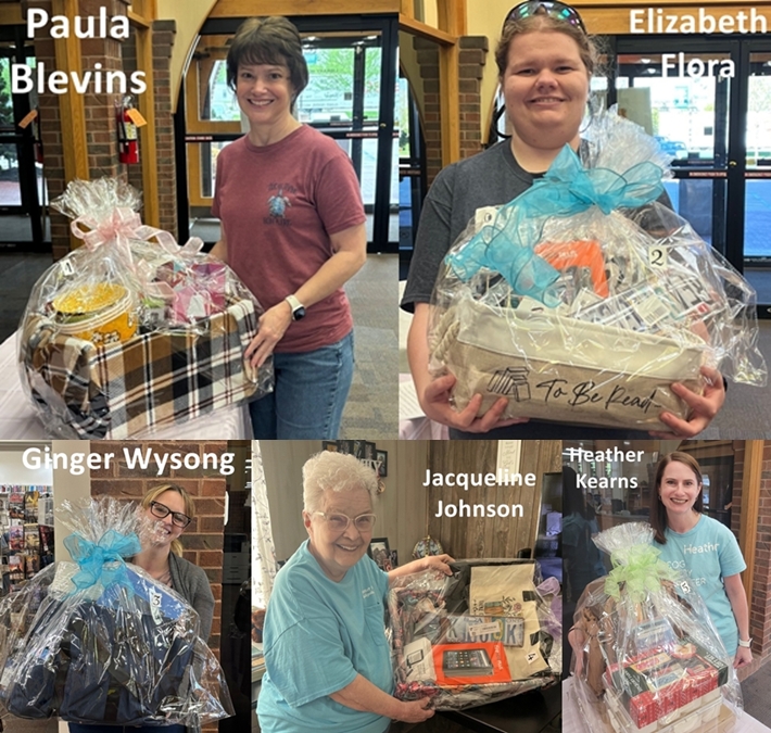 5 ladies holding prize baskets